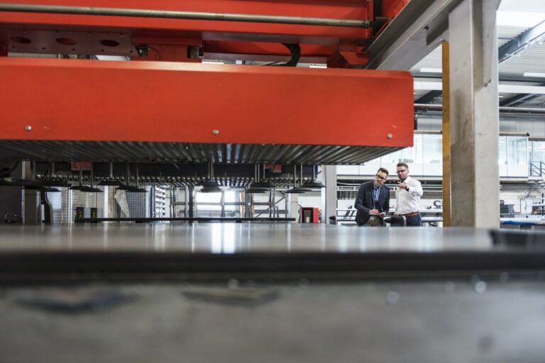 two-men-with-tablet-discussing-on-factory-shop-floor